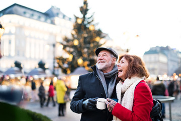 Senior couple on an outdoor Christmas market.
