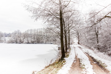 Fototapeta premium Winter countryside road in central Europe