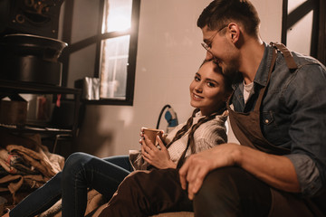 young colleagues having coffee break together during work day at coffee shop