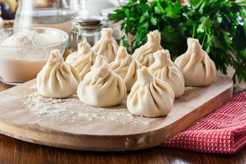 Raw Georgian dumplings - Khinkali (Chinkali) with minced meat and herbs