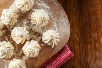 Raw Georgian dumplings - Khinkali (Chinkali) with minced meat an