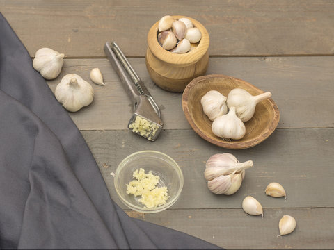 garlic on a wooden kitchen table. 
