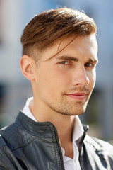 Obraz premium portrait of young man in leather jacket outdoors