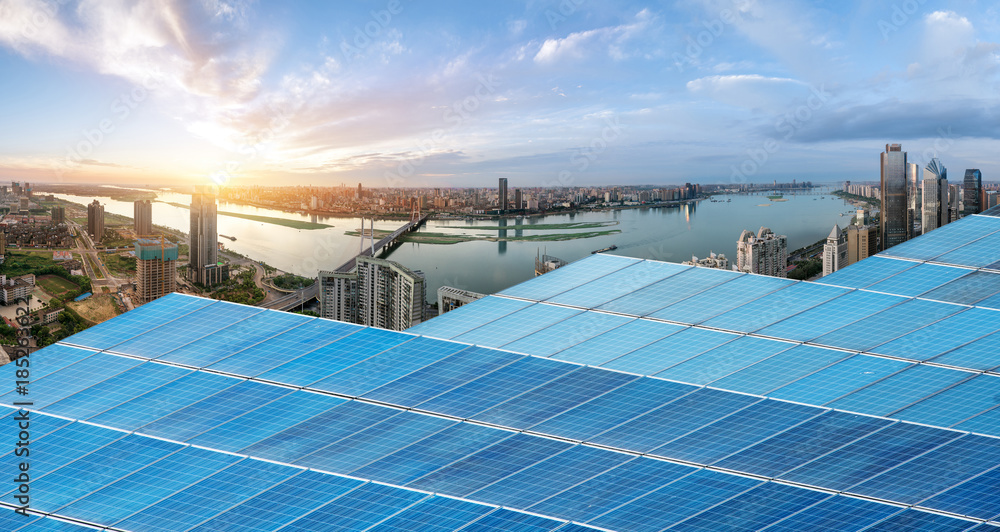 Wall mural Eco-environmentally friendly green energy of sustainable development of solar power plant with Shanghai skyline