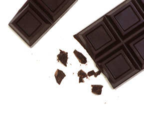 Broken chocolate bar isolated on white