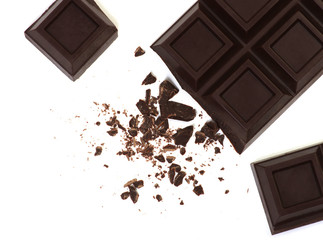 Broken chocolate bar isolated on white