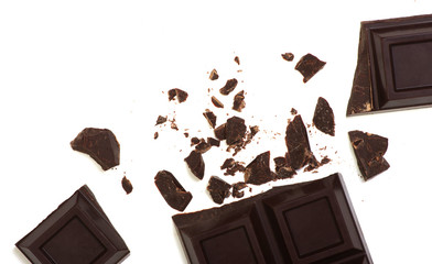 Broken chocolate bar isolated on white