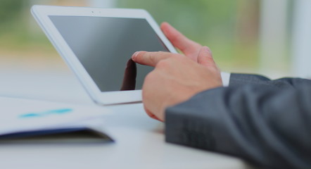 man holding digital tablet, closeup