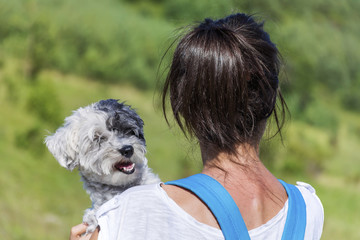 Fototapeta premium Woman Hugging her Dog in the Mountain