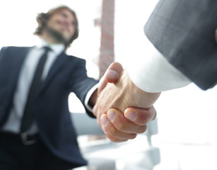 Close-up of two business people shaking hands