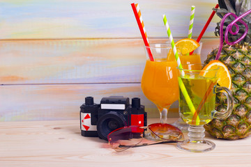 Tropical cocktails, pineapple and travelling items