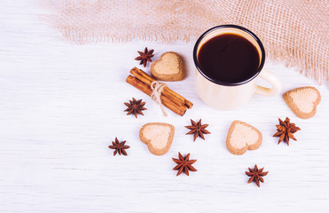 Fragrant black coffee in an iron mug. Coffee drink with spices. Copy space