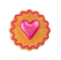 Gingerbread with heart pattern. Pink heart made of glaze on gingerbread. Isolated on white