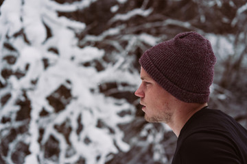 Young man running in the snow in Austria