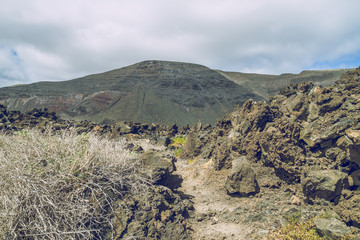 Obraz premium Lanzerote beach with vulcano rocks.