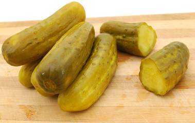 Pickled cucumbers Isolated on chopping board