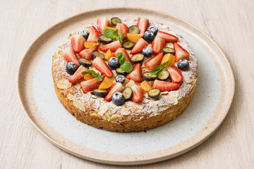 Sweet bright cakes with fruit and berries