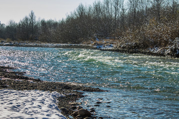 Fototapeta na wymiar River in Winter. Rapids of Stormy River. Winter Landscape.