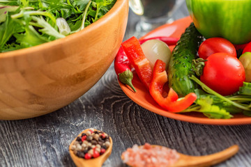 Fresh rustic vegetable salad on rustic background