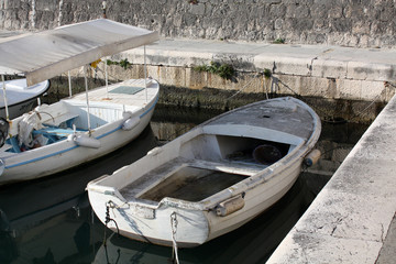 Fototapeta na wymiar Old Boats on the seacoast Adriatic