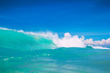 Turquoise ocean wave. Clear wave in tropics and blue sky