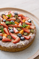 Sweet bright cakes with fruit and berries