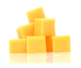 Cubes of cheddar cheese isolated on white