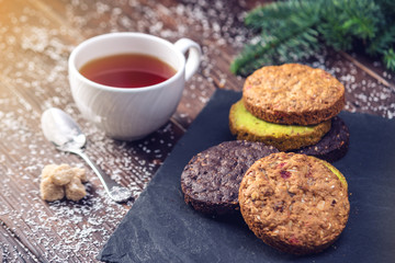 Homemade Christmas or New Year holiday oatmeal cookies with pistachios and chocolate. Concept of festive desserts