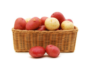 fresh potatoes in a basket isolated on white