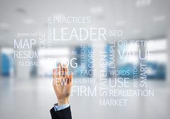 Concept of modern business with palm choocing on of keywords for success