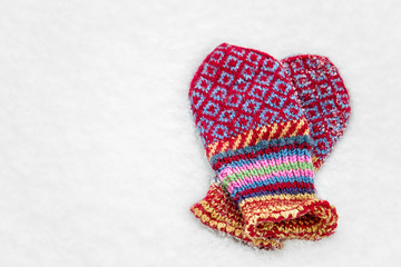 Beautiful jacquard women's mittens in the snow