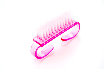 small light pink nail brush