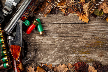 Hunting equipment on the wooden background. Hunt concept.