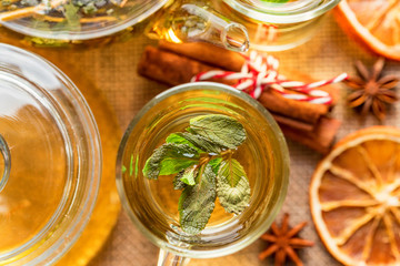 Herbal Christmas tea with honey and mint leaves