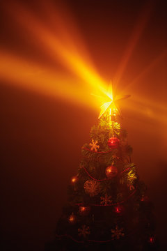 Christmas tree shiny star lights, orange background with mist