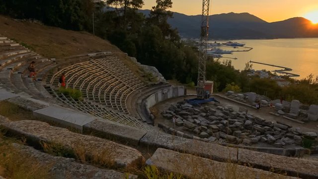 Cinematic establishing shot of the Ancient Theater in Limenas Thassos, Greece in the North Aegean Sea. Thasos is the northernmost Greek island, and 12th largest one.