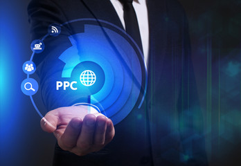 Business, Technology, Internet and network concept. Young businessman working on a virtual screen of the future and sees the inscription: PPC