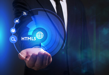 Business, Technology, Internet and network concept. Young businessman working on a virtual screen of the future and sees the inscription: HTML5