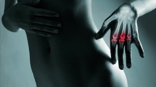 Human hand in x-ray with screen ripple and noise for electronic displays of medical equipment or pc tablet. The hand is highlighted by red colour.