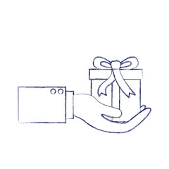 hand holding a gift box in dark blue blurred silhouette