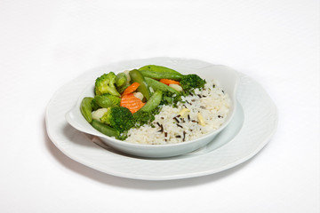 A plate of rice with vegetables