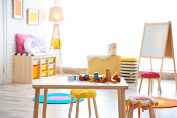 Child's room interior with colorful blocks on table