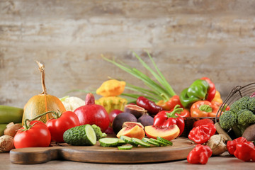 Many different fruits and vegetables on wooden background