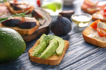 Delicious avocado toast on table, closeup
