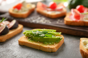 Delicious avocado toast on table, closeup