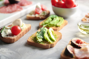 Delicious avocado toast on table, closeup