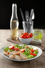 Plate with meat and delicious fresh salad on table