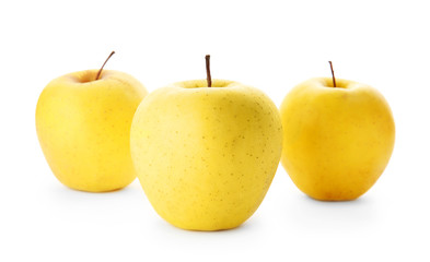 Ripe yellow apples on white background