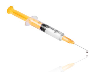 Fototapeta premium Syringe with a drop at the end of the needle closeup
