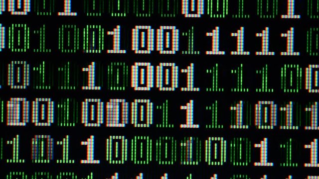 Binary code on the monitor screen.